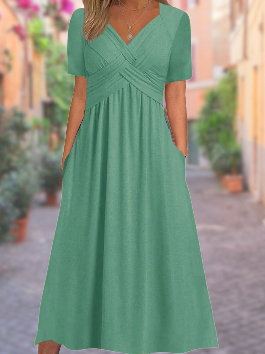 Luchtige zomerjurk met V-hals en charmante details – voor moeiteloze elegantie en warme dagen