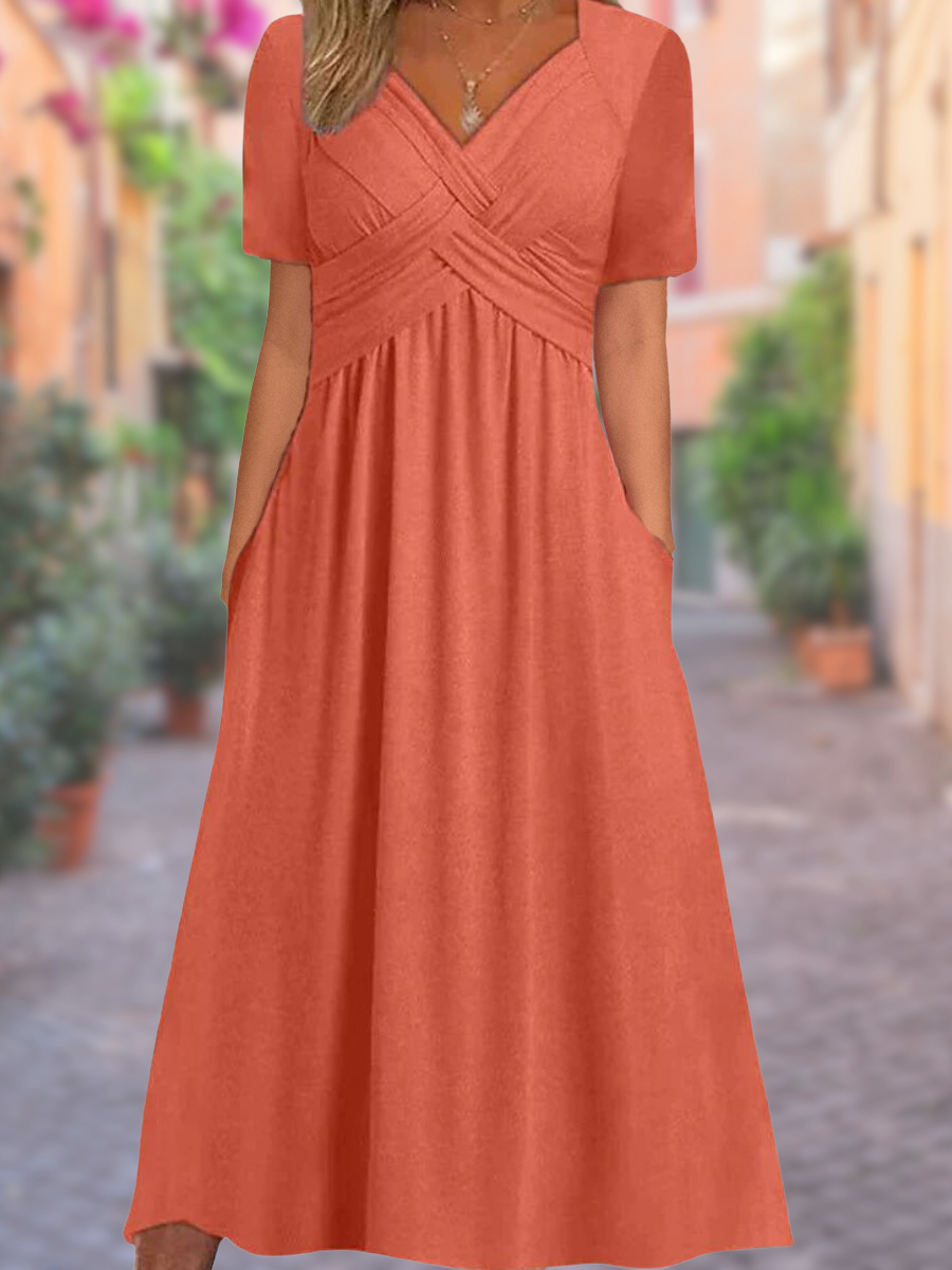 Luchtige zomerjurk met V-hals en charmante details – voor moeiteloze elegantie en warme dagen