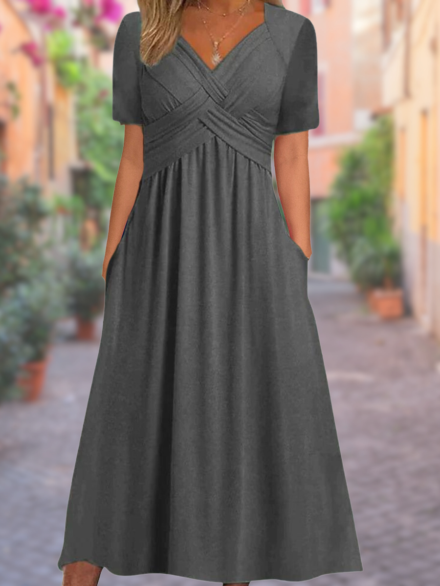 Luchtige zomerjurk met V-hals en charmante details – voor moeiteloze elegantie en warme dagen